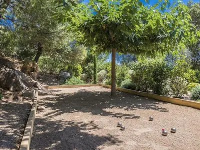 a tree with balls on the ground under it at Villa Palombaggia in Porto-Vecchio