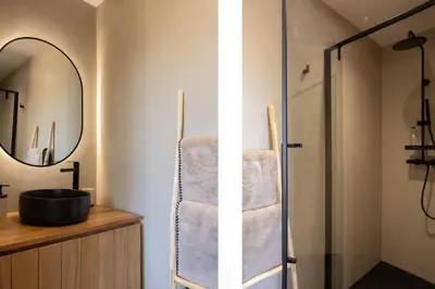 a bathroom with a sink and a mirror at Villa Yaya in Cervione