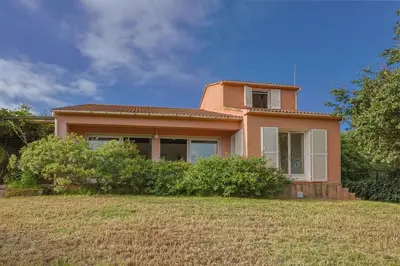 a small house with a large yard in front of it at Villa Josiane in San-Nicolao