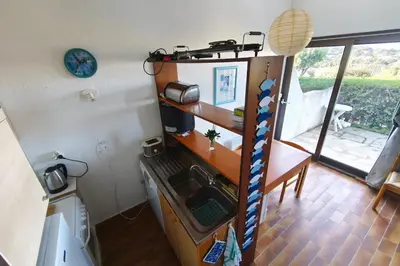 a kitchen with a bunk bed with a sink at Nice quiet accommodation in Grosseto-Prugna in Grosseto-Prugna
