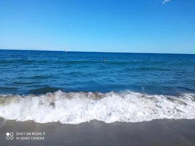 a wave in the ocean on a beach at Villa neuve à 900 m de la plage in Santa-Lucia-di-Moriani