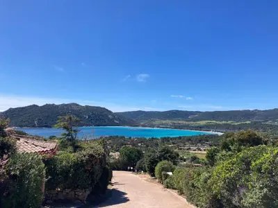 a view of a lake from a road at Villa vue mer exceptionnelle à 500m de la plage de Santa Giulia in Porto-Vecchio