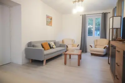 a living room with a couch and two chairs at Location F2 44 m2 in Venaco