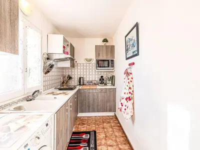 a kitchen with a sink and a counter top at Apartment T1 Gabriello by Interhome in Cala dʼOro