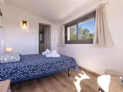 a bedroom with a bed and a window at Villa Villa Sallena by Interhome in Porto-Vecchio