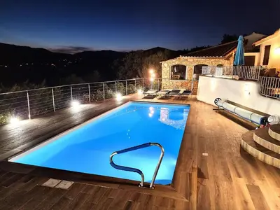 a swimming pool on the balcony of a house at night at Villa Villa Sallena by Interhome in Porto-Vecchio