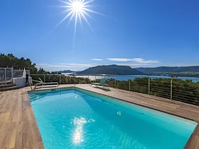 a swimming pool with a view of the water at Villa Villa Sallena by Interhome in Porto-Vecchio
