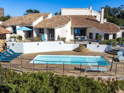 a villa with a swimming pool in front of a house at Villa Villa Sallena by Interhome in Porto-Vecchio
