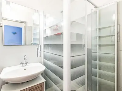 a bathroom with a sink and a shower at Apartment T2 Gabriello by Interhome in Cala dʼOro