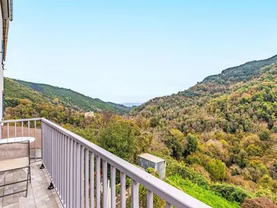 a balcony with a view of the mountains at Holiday Home Casa Santa Reparata by Interhome in Santa-Reparata-di-Moriani