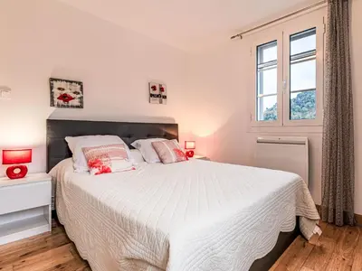 a bedroom with a large bed and a window at Holiday Home Casa Santa Reparata by Interhome in Santa-Reparata-di-Moriani