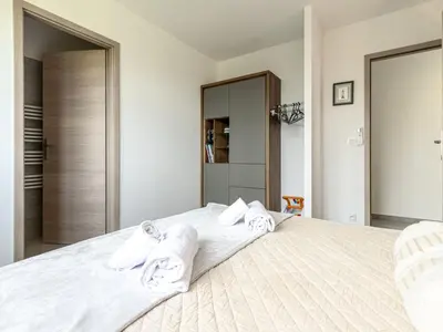 a bedroom with a large bed with towels on it at Villa Villa Lamas by Interhome in Sainte-Lucie de Porto-Vecchio