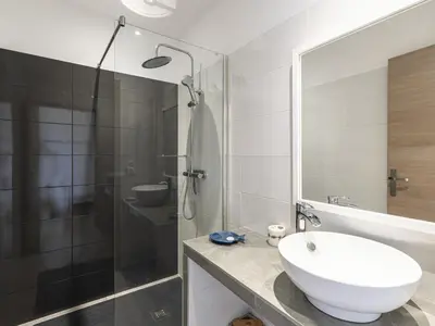 a bathroom with a sink and a glass shower at Villa Villa Lamas by Interhome in Sainte-Lucie de Porto-Vecchio