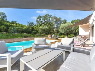 a patio with white furniture and a swimming pool at Villa Villa Lamas by Interhome in Sainte-Lucie de Porto-Vecchio