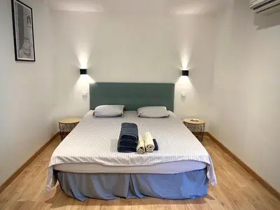 a bed in a room with two shoes on it at Casa Chiaverini in Lecci