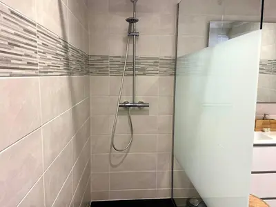 a shower with a glass door in a bathroom at Casa Chiaverini in Lecci
