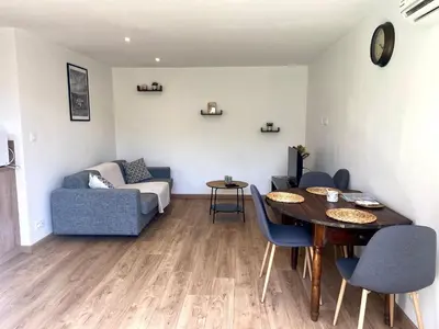a living room with a table and a couch at Casa Chiaverini in Lecci