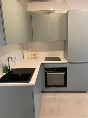 a kitchen with a sink and a stove at Charmant appartement hyper centre in Ajaccio