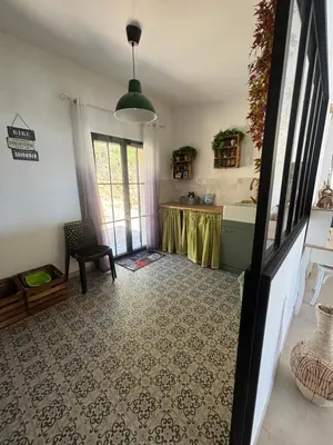 a living room with a table in a room at Casa Nostra in Olmeto
