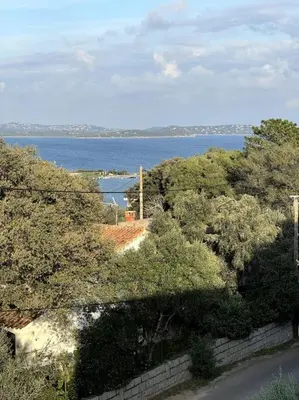 a view of a body of water with trees at Spacieux 2 chambres Centre-ville de Porto-Vecchio in Porto-Vecchio