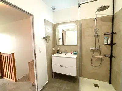 a bathroom with a sink and a shower at Duplex Tour d'Omigna Cargèse in Cargèse