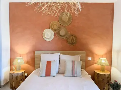 a bedroom with a bed with two lamps and two pillows at Nouveauté ! Bel'Orizonte T - Deux Chambres proche mer in Propriano