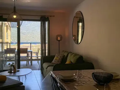 a living room with a couch and a table at Nouveauté ! Bel'Orizonte T - Deux Chambres proche mer in Propriano