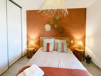 a bedroom with a large bed with two lamps at Nouveauté ! Bel'Orizonte T - Deux Chambres proche mer in Propriano
