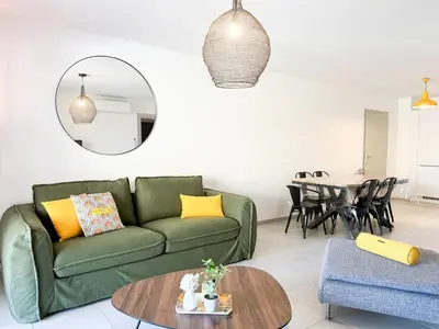 a living room with a green couch and a table at Nouveauté ! Bel'Orizonte T - Deux Chambres proche mer in Propriano