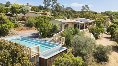 an aerial view of a house with a swimming pool at Villa Gaïa, 6 pers, piscine chauffée, 3 min plage in Sainte-Lucie de Porto-Vecchio