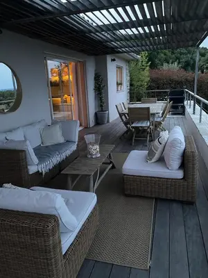 a garden with wooden steps and rocks and trees at VISTA CORSICA saison #2 vue à couper le souffle in Sotta