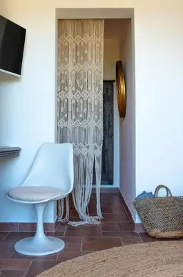 a bedroom with a large bed with two pillows on it at VISTA CORSICA saison #2 vue à couper le souffle in Sotta
