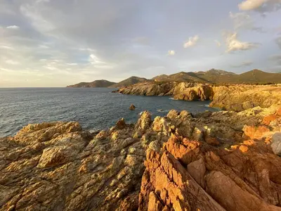 a view of the ocean from a rocky coast at Villa des Chênes in Figari