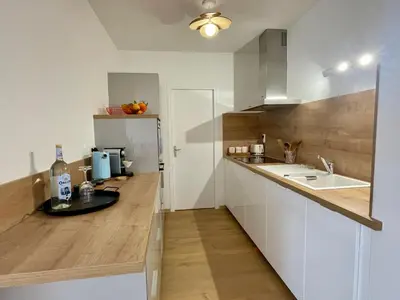 a kitchen with a sink and a counter top at Appartement Marinella route des Sanguinaires Corse in Ajaccio
