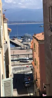 an aerial view of a city with the ocean at studio centre ville in Ajaccio