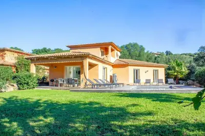 a house with a lawn in front of it at Villa Belladona Di Arasu in Sainte-Lucie de Porto-Vecchio
