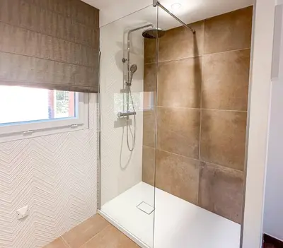 a shower with a glass door in a bathroom at Villa Belladona Di Arasu in Sainte-Lucie de Porto-Vecchio