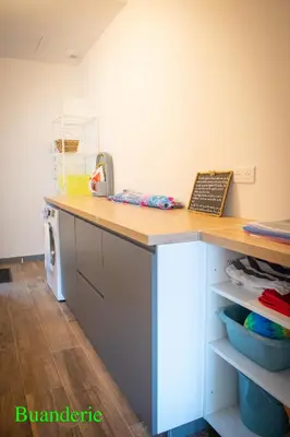 a kitchen with a counter with a telephone on it at A l'Orée du Maquis Villa 6 personnes in Bonifacio