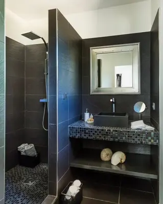 a bathroom with a sink and a mirror at Villa en pierre avec piscine chauffée, à proximité des plus belles plages du sud de la Corse ! in Figari