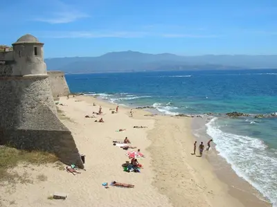a group of people on a beach near the ocean at T4 Terrasses Vieille ville, Ajaccio in Ajaccio