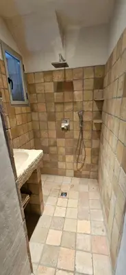 a bathroom with a shower with a sink at Marina-piscine privée-wifi-Accès Sporting Club Marina di Fiori in Porto-Vecchio