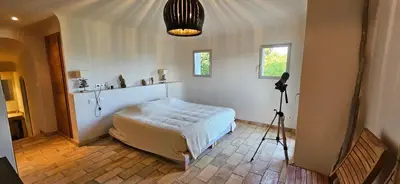 a room with a bed and a camera in it at Marina-piscine privée-wifi-Accès Sporting Club Marina di Fiori in Porto-Vecchio