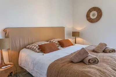 a bedroom with a bed with two pillows on it at Casa Rocca Di Pianotolli in Pianottoli-Caldarello