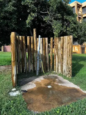 a fence with a baseball bat next to it at Studio les pieds dans l'eau in Santa-Lucia-di-Moriani