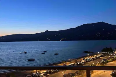 a view of a beach with boats in the water at Superbe T3 front de mer au centre de Propriano in Propriano