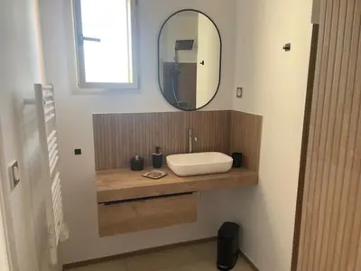a bathroom with a sink and a mirror at Casa Mimosa in Piana
