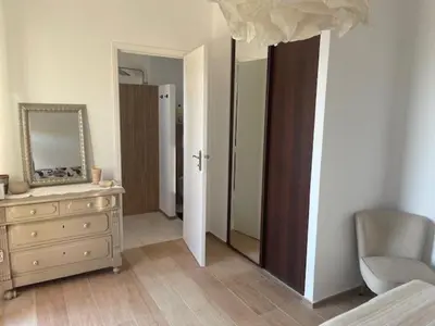 a bedroom with a dresser and a mirror at Casa Mimosa in Piana