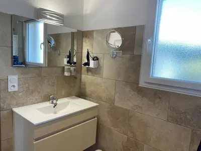 a bathroom with a sink and a mirror at La Carpe Diem in Cervione