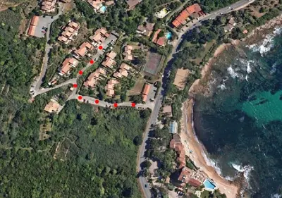 an aerial view of a house complex next to the ocean at So Leil So Fun à Porticcio - 45m2 - Grand lit 180 - Plage à pied - Wifi fibre - Terrasse in Porticcio