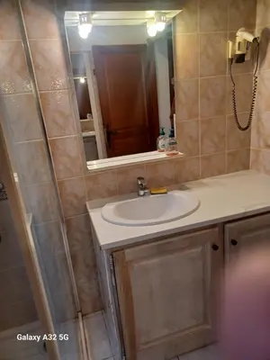 a bathroom with a sink and a mirror at Residence les Lavandes in Olmeto